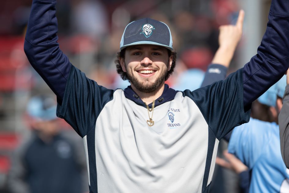 Baseball player throwing up hands in cheer